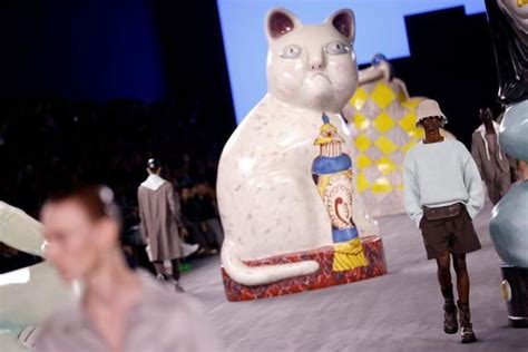 dior fashion shows with animals|Giant cats stalk the catwalk at the Dior men's show .